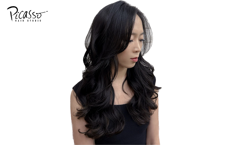 Long hair with curtain bangs, a popular Singaporean hairstyle.